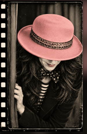 Full original portrait of a woman in a dusty-pink hat framed by vintage filmstrip edges